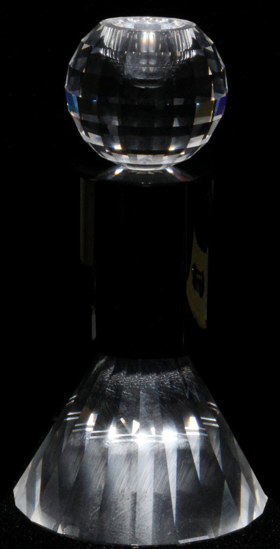 SWAROVSKI CRYSTAL FOOTED CANDLE HOLDER, H 7": SWAROVSKI CRYSTAL FOOTED CANDLE HOLDER, H 7":having a clear faceted spherical cup, black cylindrical shaft and clear cone shape footed base;
