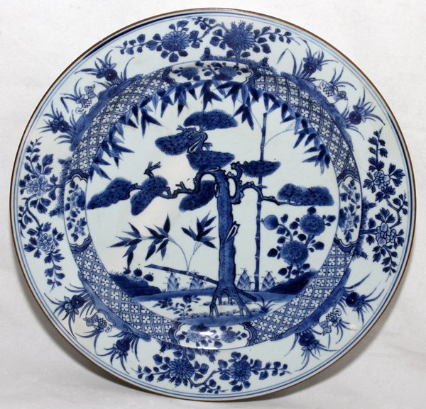 CHINESE BLUE & WHITE PORCELAIN CHARGER, C. 1800: CHINESE BLUE & WHITE PORCELAIN CHARGER, C. 1800, DIA 13 3/4":Flowering tree at the well, diapered cavetto and floral motif about the border. From the Estate of Charles Chevalier, Mt Clemens, Mich.