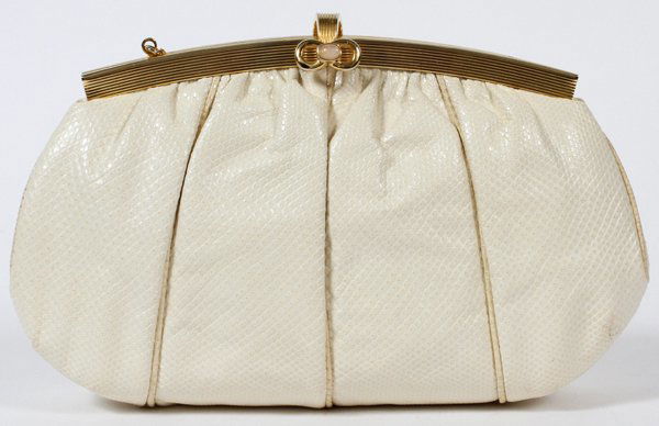 JUDITH LEIBER IVORY LIZARDSKIN EVENING BAG: JUDITH LEIBER IVORY LIZARDSKIN EVENING BAG, W 8 3/4":Gold tone frame set with a single cabochon at the clasp, opening to white silk lining and gold tone shoulder strap. Stamped: Judith Leiber, Made in