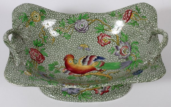COPELAND SPODE CENTERPIECE/FRUIT BOWL LATE 19TH: COPELAND SPODE CENTERPIECE/FRUIT BOWL, LATE 19TH C., H 4", L 11 1/2":Elongated shape flanked by handles, the well decorated with a colorful bird on a flowering branch, motif repeats about the exterior