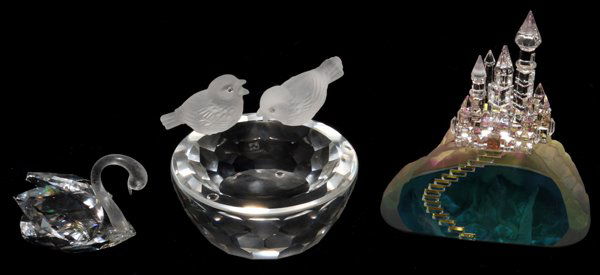 SWAROVSKI CRYSTAL GROUPING, THREE PIECES: SWAROVSKI CRYSTAL GROUPING, THREE PIECES:Including 1 swan, L.2", 1 round bowl with two birds perched at the rim, Dia.3", both are signed, and 1 castle, H.4", felt at the underside.