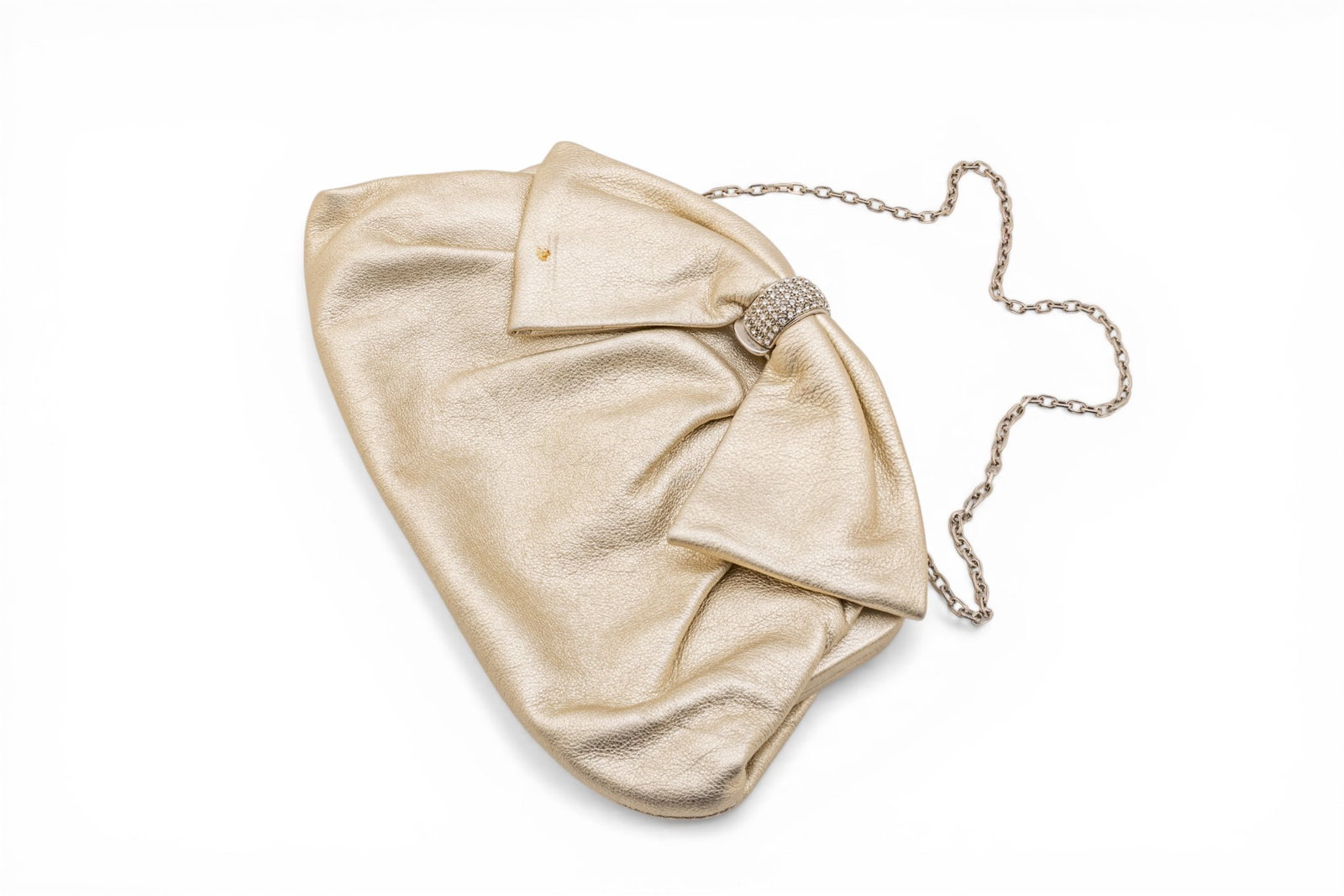 Valentino (Italian) Champagne Gold Leather Small Evening Frame Bag H 6" W 10" Depth 1.25": Valentino (Italian) Champagne Gold Leather Small Evening Frame Bag H 6" W 10" Depth 1.25" Pleated leather with bow design to top and rhinestone encrusted clasp, silver hardware. Provenance: Property f