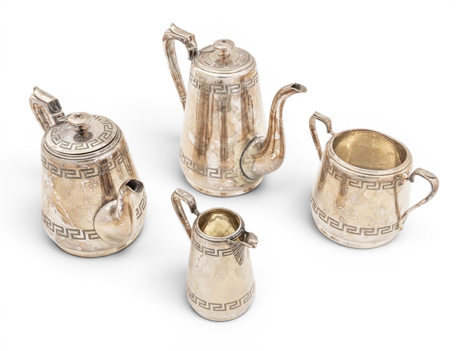 Silver Plate Tea and Coffee Service Early 20th C., 4 PCS: Silver Plate Tea and Coffee Service Early 20th C., 4 PCS Comprising teapot, coffee pot, sugar bowl, and creamer; with ovoid bodies with double Greek key borders, scrolled sprouts and handles. Pr