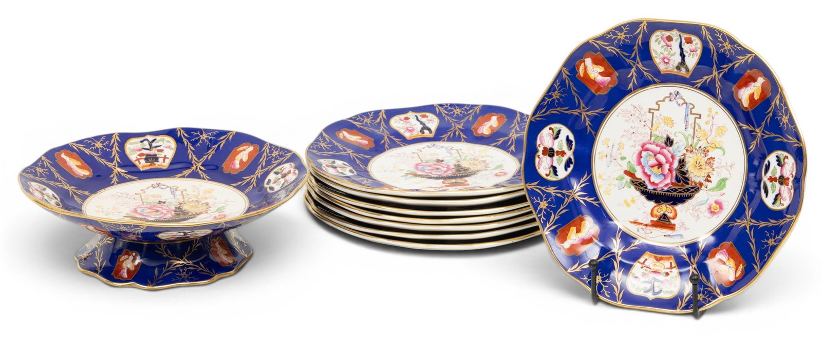 Masons Ironstone Porcelain Plates & Footed Dish 20th C., Dia. 8.75" 9 PCS: Masons Ironstone Porcelain Plates & Footed Dish 20th C., Dia. 8.75" 9 PCS A group of eight hand painted plates with cobalt blue border decorated with alternating foliates and figures. The center with 