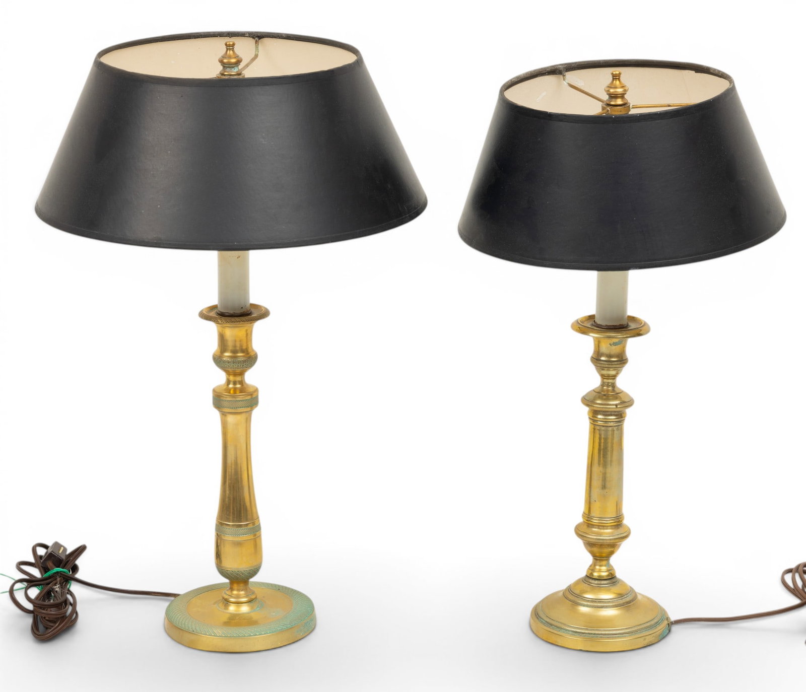 Two Brass Candlestick Lamps, Ca. 20th C., H 19" Dia. 4.75" 2 PCS: Two Brass Candlestick Lamps, Ca. 20th C., H 19" Dia. 4.75" 2 PCS Includes two black paper shades Dia 9.75". Provenance: From the Estate of Frank Isbey, by descent through his family. Dimensions: H