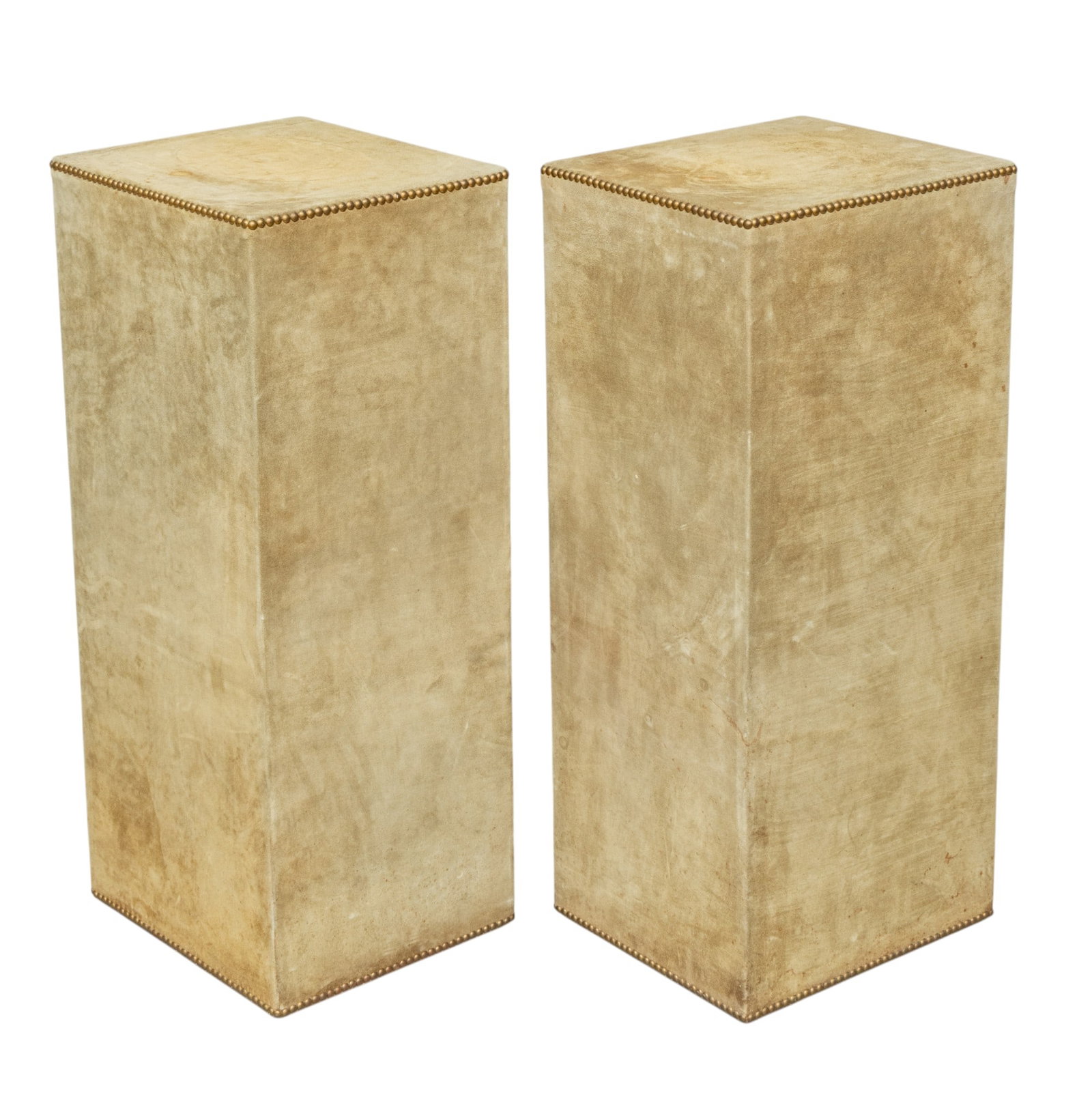 Suede Covered Display Pedestals, H 35.5" W 13.5" L 15.5" 1 PAIR: Suede Covered Display Pedestals, H 35.5" W 13.5" L 15.5" 1 PAIR Beige suede over wooden frames. Brass nail head trim. Provenance: Property of a Grosse Pointe Park, MI private collector.
