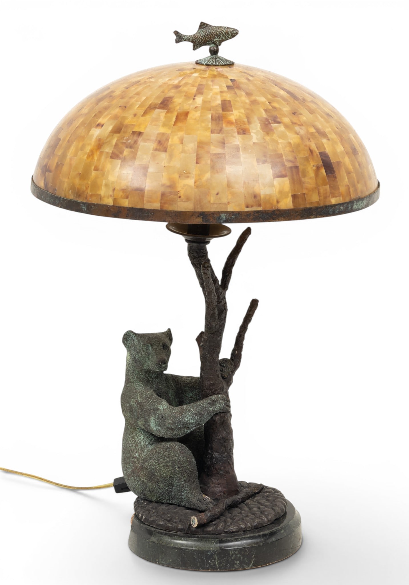 Maitland Smith (English) Bronze Bear Lamp, H 24" Dia. 15": Maitland Smith (English) Bronze Bear Lamp, H 24" Dia. 15" Green and black patina. Seated bear wrapping it's arms around a tree trunk. Having a faux tortoise shell plastic shade. Bronze fish-form