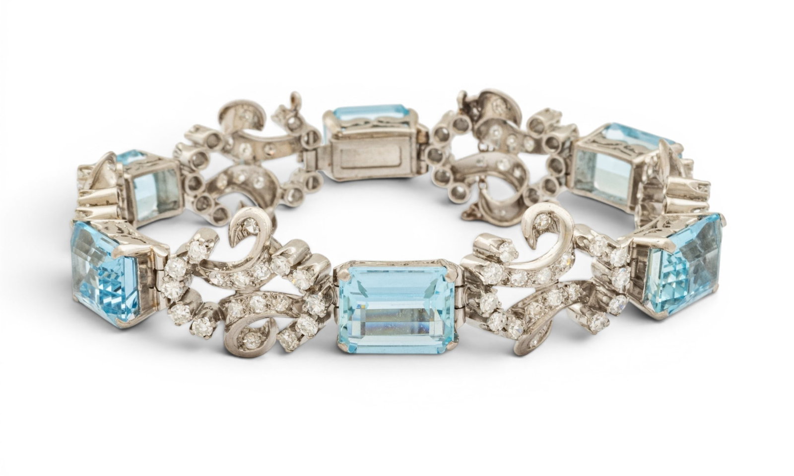 Platinum, Aquamarine, and Diamond Bracelet L 7" 35.5 g: Platinum, Aquamarine, and Diamond Bracelet L 7" 35.5 g A fabulous platinum link bracelet having 6 emerald cut aquamarines and diamond melee accents with scrolled details, box clasp, and safety chain. 
