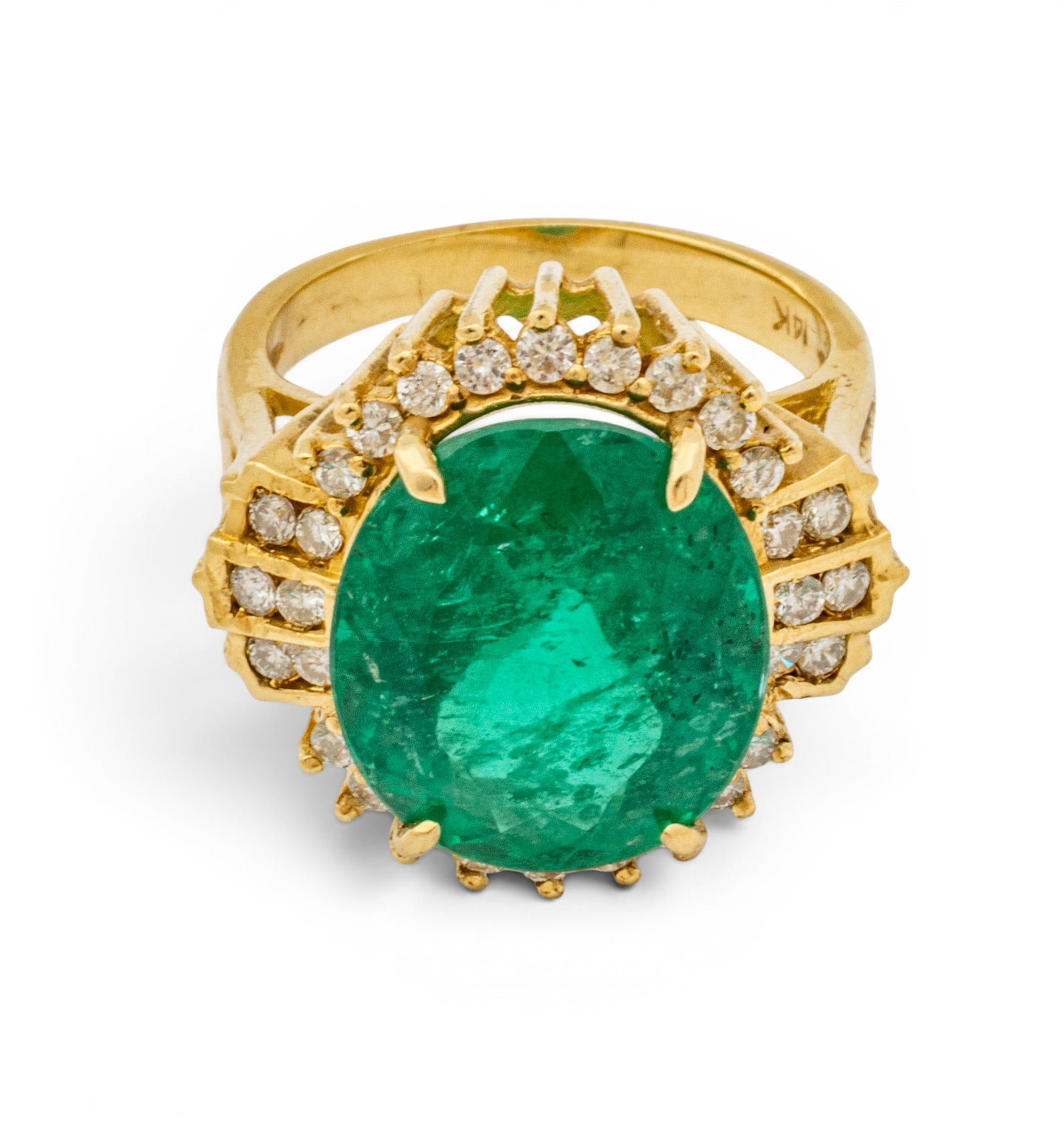 14k Yellow Gold, Emerald, and Diamond Cocktail Ring Size 6.5 8.7 g: 14k Yellow Gold, Emerald, and Diamond Cocktail Ring Size 6.5 8.7 g A statement cocktail ring having an oval faceted emerald prong set in 14k yellow gold with diamond melee surround. Marked 14k to the 
