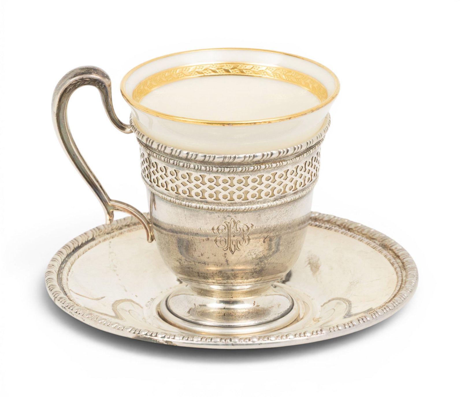 Lenox and Sterling Demitasse Set for 12, #41 36 PCS: Lenox and Sterling Demitasse Set for 12, #41 36 PCS Including 12 sterling holders, 12 saucers, 12 Lenox porcelain cups. Maker is a "W" with a ray at each side, for Frank Whiting Co. In original case. 