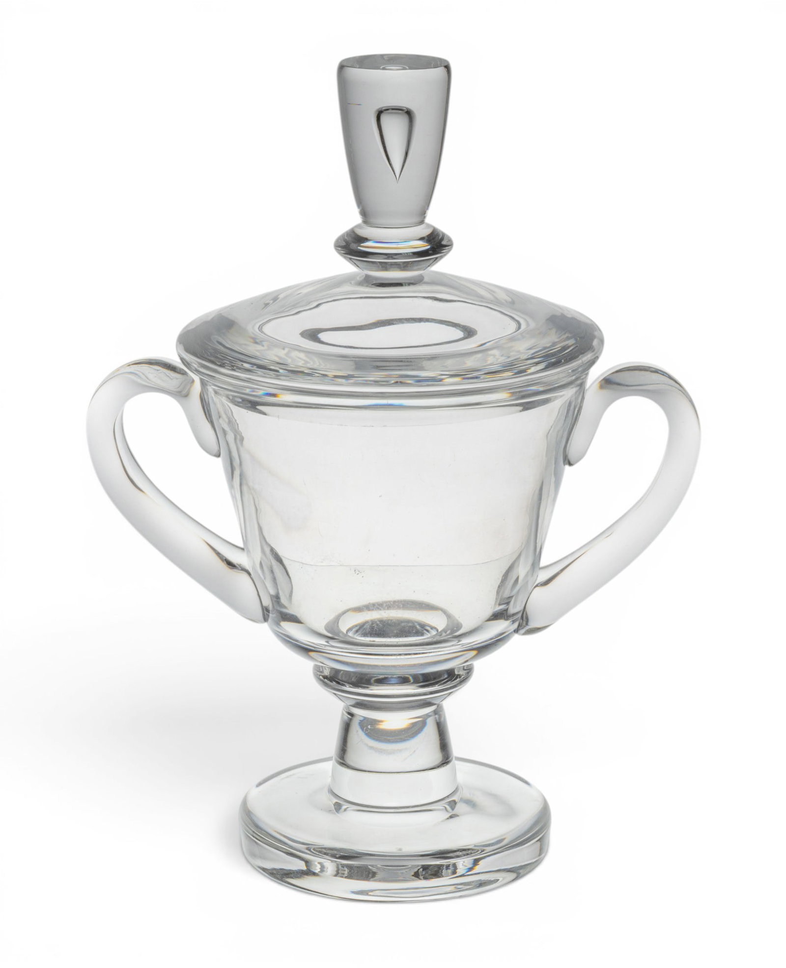 Steuben Glass Works (American) Blown Glass Teardrop Covered Urn H 11" W 8": Steuben Glass Works (American) Blown Glass Teardrop Covered Urn H 11" W 8" On pedestal base, double handles. Signed on underside. Provenance: Property from the Collection of Marianne Endicott, G