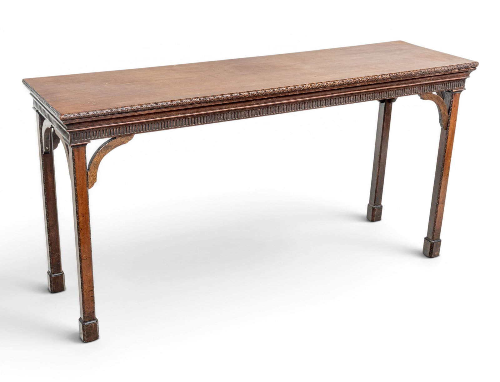 English George III Mahogany Console Table, Ca. Early 19th C., H 21" W 63" Depth 18" 1 PAIR: English George III Mahogany Console Table, Ca. Early 19th C., H 21" W 63" Depth 18" 1 PAIR The long rectangular top with carved and molded edge above a stop-fluted frieze, on four square legs with car