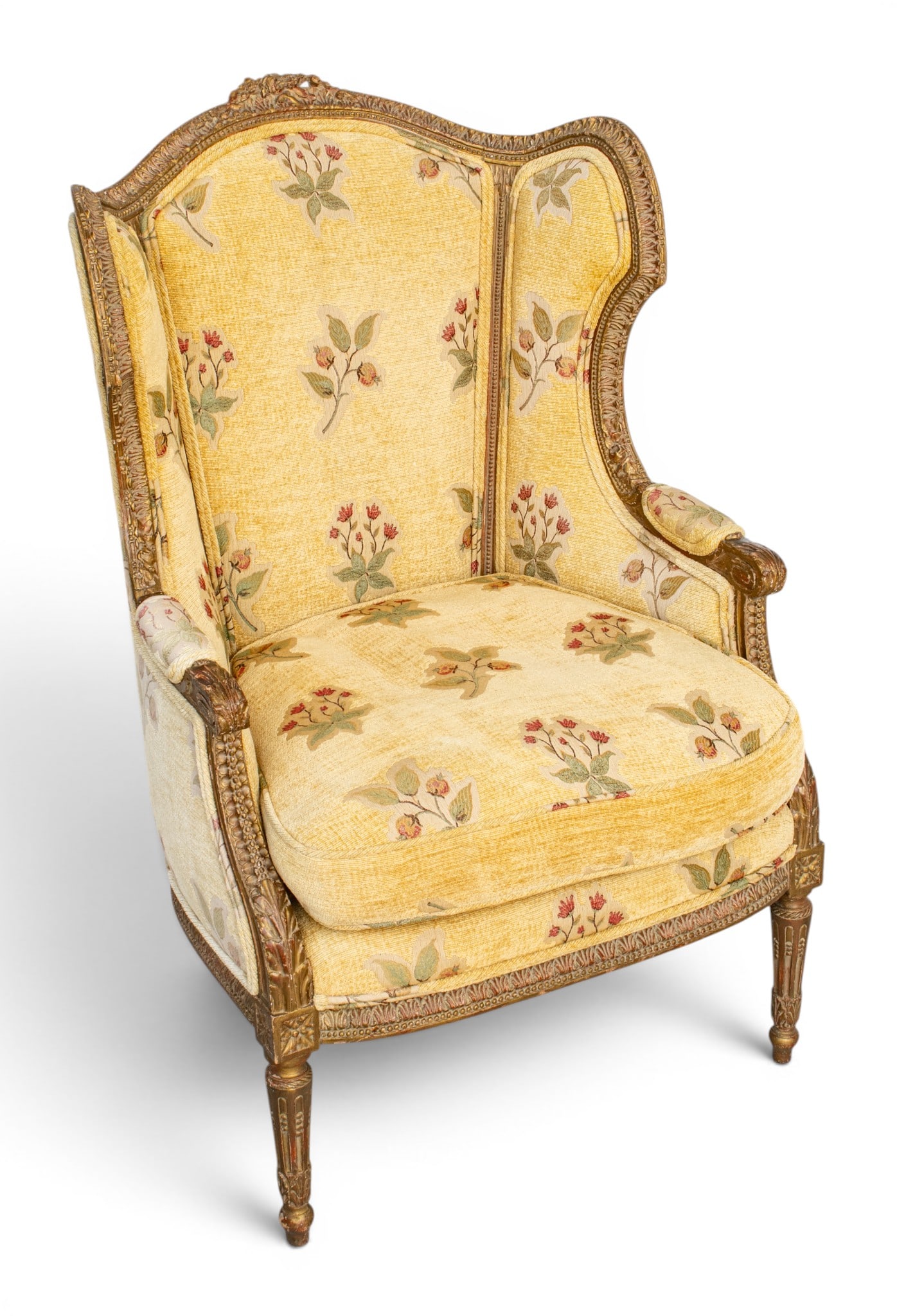 In the Manner of Ponce Gérard Louis XVI Style Hand Carved and Gilded Bergère À: In the Manner of Ponce Gérard Louis XVI Style Hand Carved and Gilded Bergère À Oreilles 19th C., H 42" W 26" Depth 21" With a carved walnut frame with gilt highlights, a carved floral c