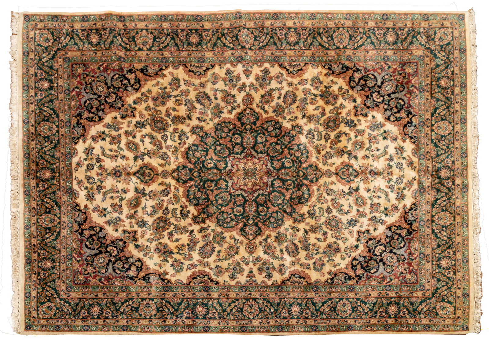 Persian Closed Field Kerman Handwoven Wool Rug, Ca. 1950, W 8' 3" L 10' 2": Persian Closed Field Kerman Handwoven Wool Rug, Ca. 1950, W 8' 3" L 10' 2" Having a central emerald green medallion with bold geometric floral designs. Surrounded by an ivory field with floral sprays 