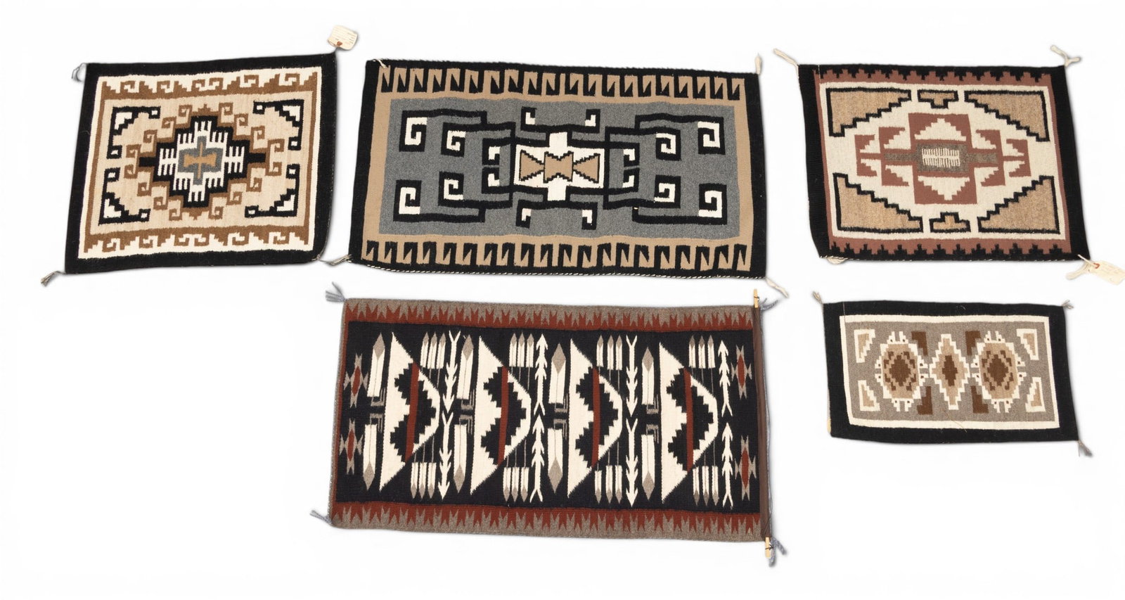 Navajo Handwoven Wool Two Grey Hills Weavings, 20th C., 5 PCS: Navajo Handwoven Wool Two Grey Hills Weavings, 20th C., 5 PCS See itemized listing. Provenance: Property of Prominent Collector, Birmingham, Michigan Dimensions: (1.) Black field with central ivory