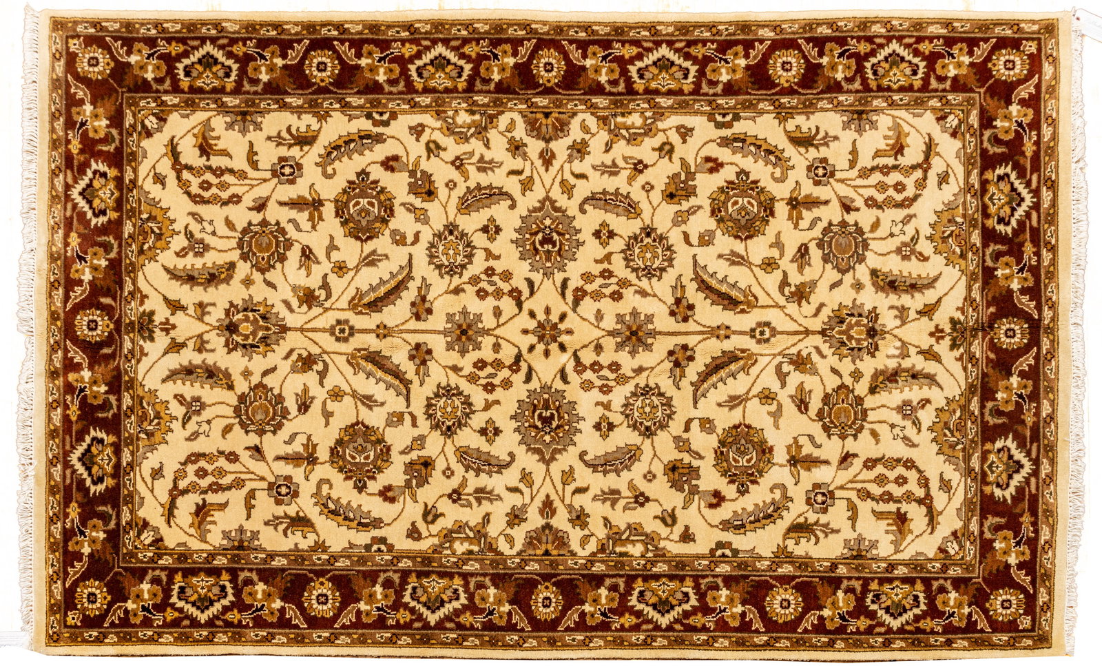 Indo-Tabriz Handwoven Wool Rug, Ca. 1990, W 5' 11" L 9': Indo-Tabriz Handwoven Wool Rug, Ca. 1990, W 5' 11" L 9' Ivory field with scrolling vine and floral designs. Rust outer border. 37 x 17 rolled up Provenance: Property from the collection of