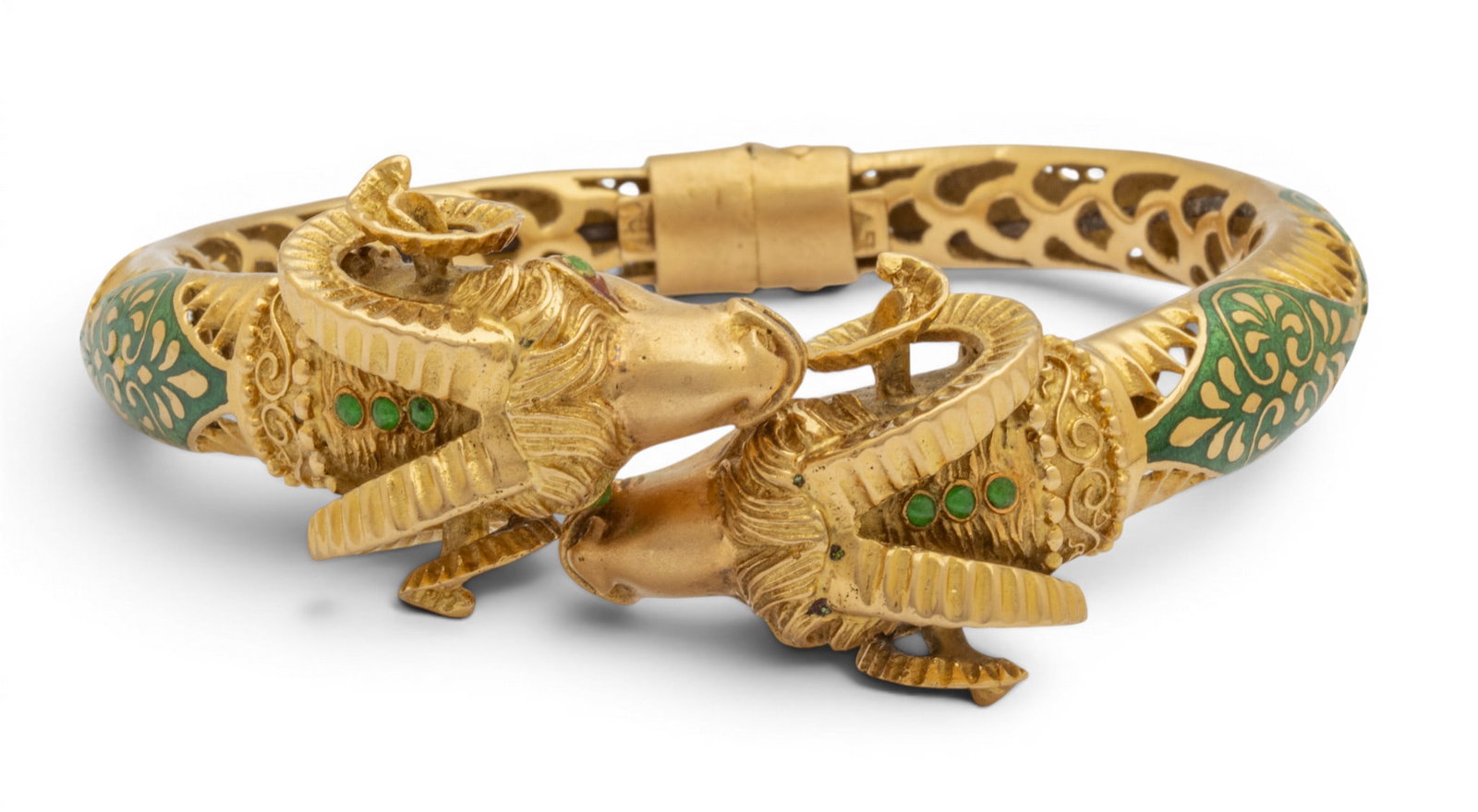 18K Gold Hinged Ram Cuff Bracelet 34.7 grams 1 PC: 18K Gold Hinged Ram Cuff Bracelet 34.7 grams 1 PC Impressed 750 on hinge. Green enamel accents. Turquoise eyes. Provenance: Property from a Bloomfield Hills, MI private collector. Dimensions: 34