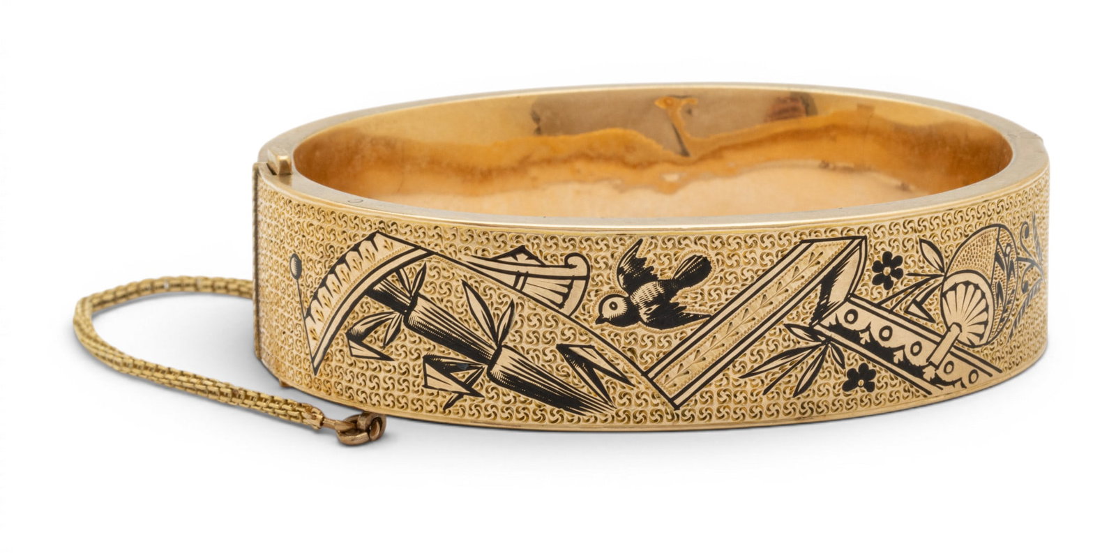10k Yellow Gold and Enamel Bangle Bracelet 1900, W 2.5" 26 grams 1 PC: 10k Yellow Gold and Enamel Bangle Bracelet 1900, W 2.5" 26 grams 1 PC 10k Gold and black enamel. With safety chain. Unmarked, gold electronically tests as 10k. Pat #75. Provenance: Property from a Blo