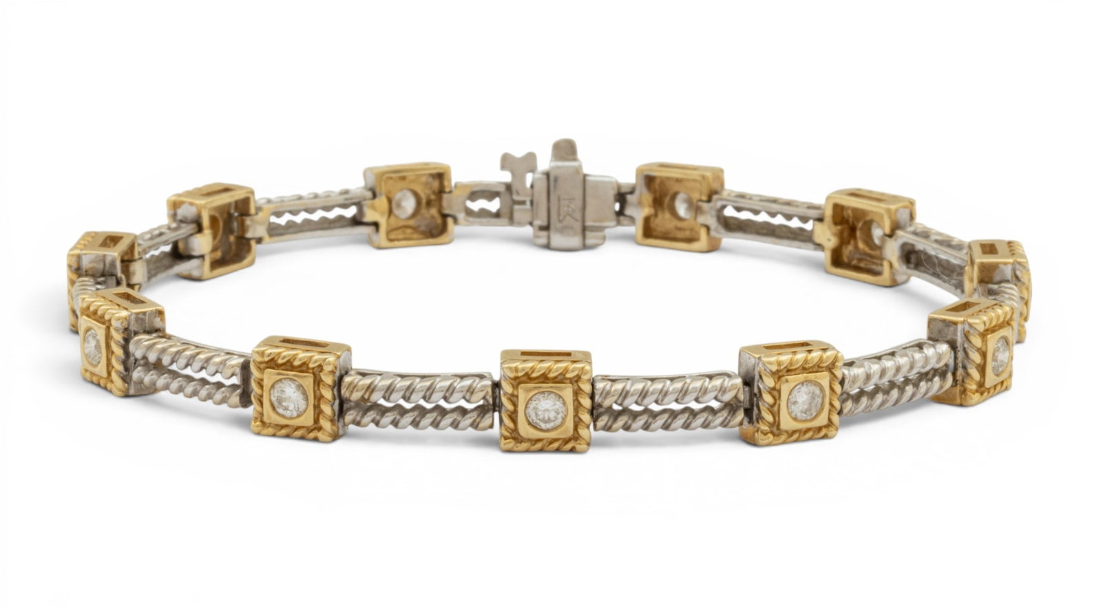14K White and Yellow Gold Chain Bracelet, Diamond Enhanced 1980, L 7.2" 18 grams 1 PC: 14K White and Yellow Gold Chain Bracelet, Diamond Enhanced 1980, L 7.2" 18 grams 1 PC 11 bezel set natural diamonds approximately .10ct each Provenance: Property from the estate collection of Rose Kor