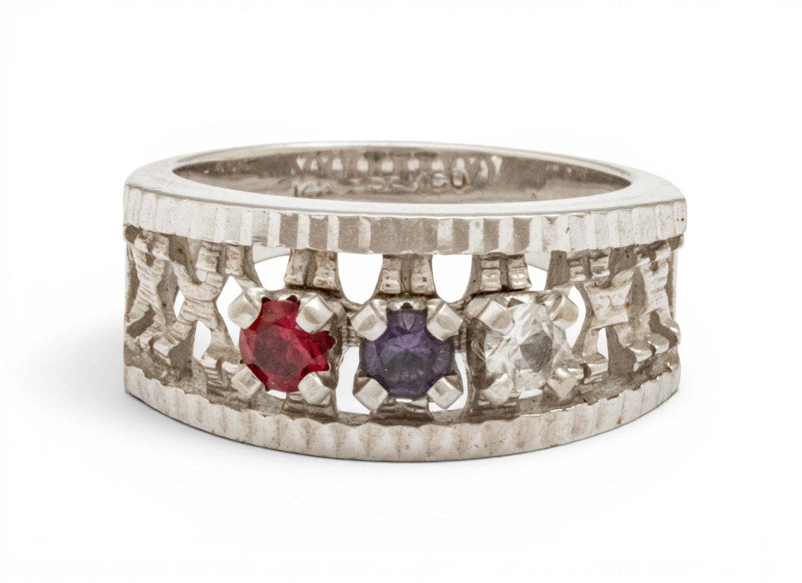 14K Gold Band Pinkie Ring, Size 4 4 grams 1 PC: 14K Gold Band Pinkie Ring, Size 4 4 grams 1 PC Prong set ruby and blue sapphire @ .03. Impressed 14K and ESCM Co. Provenance: Property from the estate collection of June Pertner, jewelry and dec