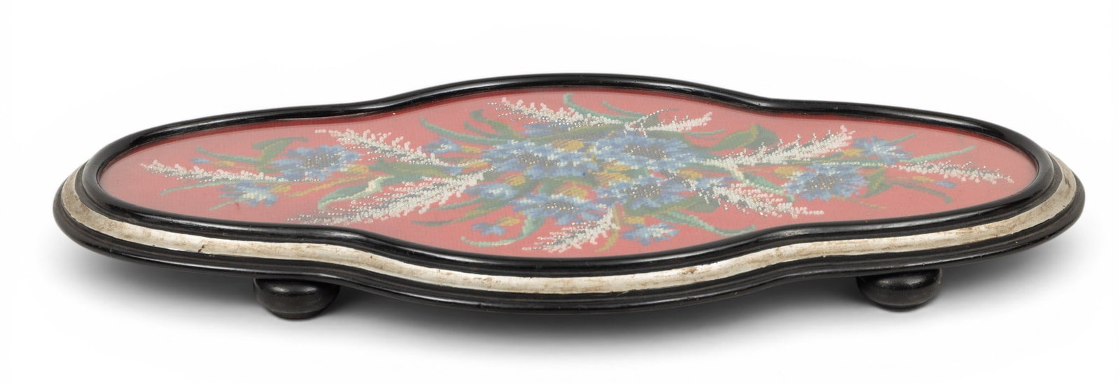 Table Top Wood Tray, Beadwork 1880, W 12" L 21" 1 PC: Table Top Wood Tray, Beadwork 1880, W 12" L 21" 1 PC Tray is oval and footed. Inset beadwork of garden flowers against a red ground is hand worked. Provenance: Property of a Bloomfield Hills, MI