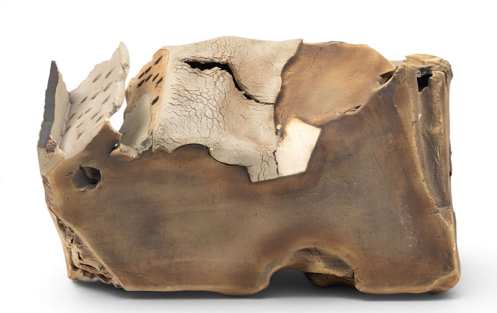 American Ceramic Sculpture, Ca. 1970/80, H 15" W 22.5" Depth 10": American Ceramic Sculpture, Ca. 1970/80, H 15" W 22.5" Depth 10" No apparent signature or markings. Hollow ceramic sculpture in tones of brown. With incised lines and texturing. Boot print at one side