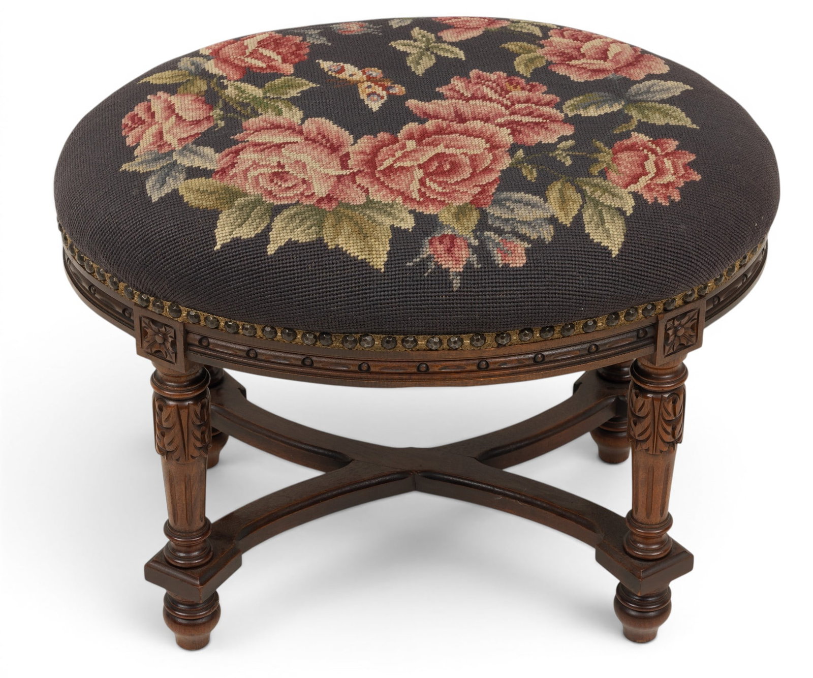 Louis XVI Style Carved Walnut Stool, Needlepoint Cover 1900, H 15" W 16" L 22": Louis XVI Style Carved Walnut Stool, Needlepoint Cover 1900, H 15" W 16" L 22" Oval with carved tapered legs joined by stretcher. Attractive accent. Provenance: Property of a Bloomfield Hills, M
