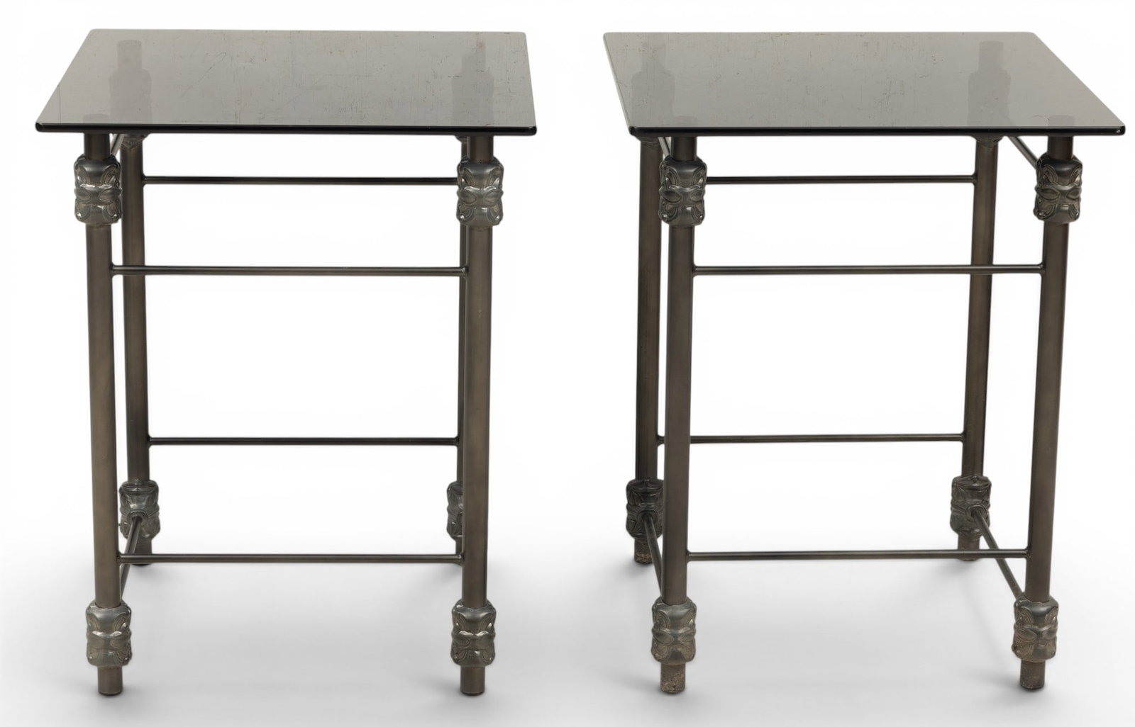 Iron and Smoked Glass End Tables, Ca. Late 20th C., H 28.5" W 23" Depth 23" 1 PAIR: Iron and Smoked Glass End Tables, Ca. Late 20th C., H 28.5" W 23" Depth 23" 1 PAIR Having square smoked glass tops above an iron base with box stretchers. Provenance: Property from the collection Bern