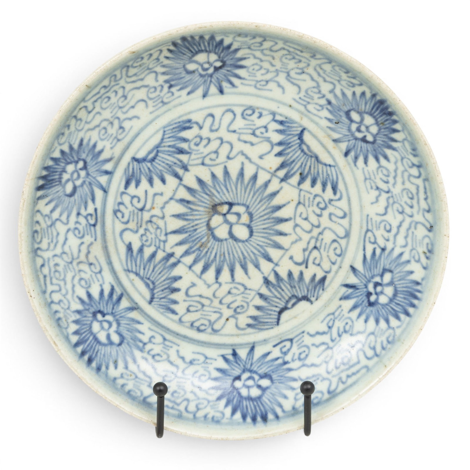 Chinese Blue on White Porcelain Dish 18th C., Dia. 9": Chinese Blue on White Porcelain Dish 18th C., Dia. 9" Blue on white hand painted motif of flower blossoms and petals. Unglazed foot and underside. Provenance: Property from a Utica, MI private c