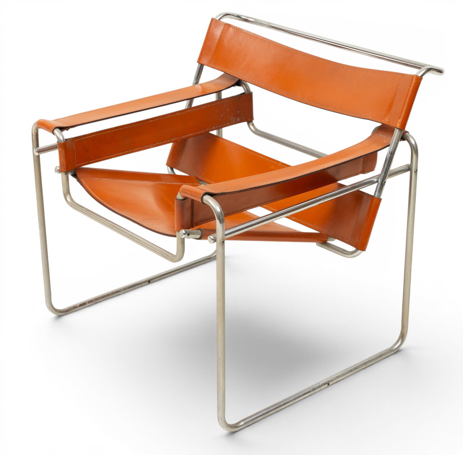 Wassily Chair H 28.75" W 30.5" Depth 30": Wassily Chair H 28.75" W 30.5" Depth 30" Chromed steel tube construction with brown leather seat, side panels, armrests and backrest. Dimensions: H 28.75" W 30.5" Depth 30"