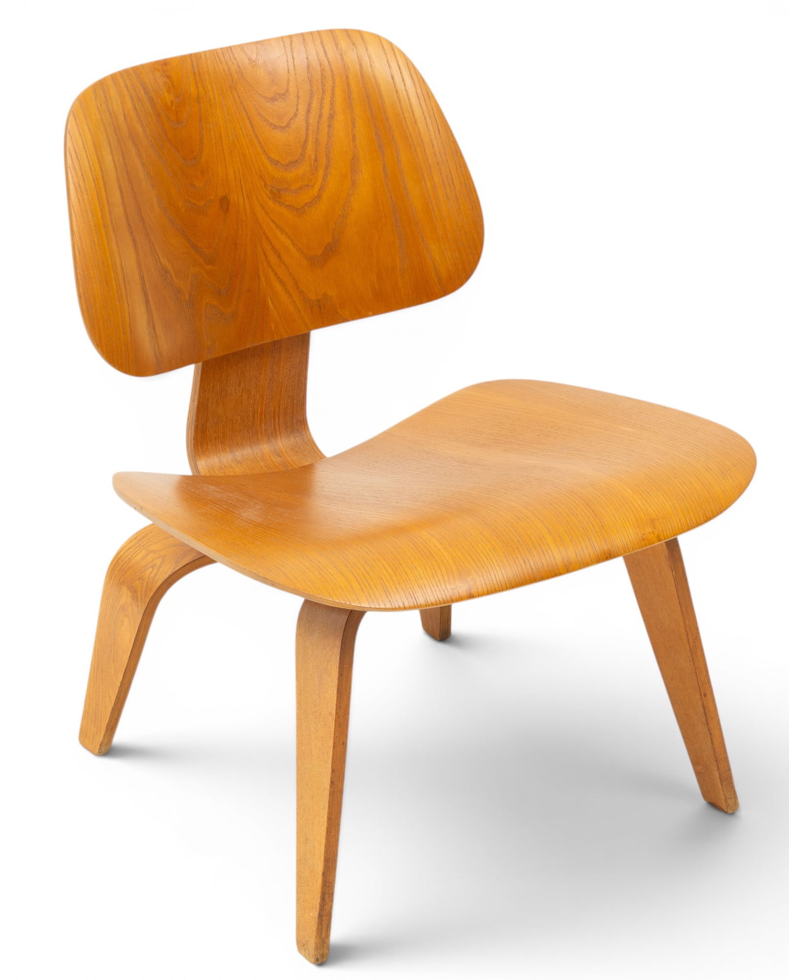 Charles and Ray Eames for Herman Miller (American) Molded Plywood LCW Potato Chip Chair, Ca.: Charles and Ray Eames for Herman Miller (American) Molded Plywood LCW Potato Chip Chair, Ca. 1950-1957, H 26.5" W 22" Depth 22" Molded plywood. Small aluminum feet to base. No markings. Provenan