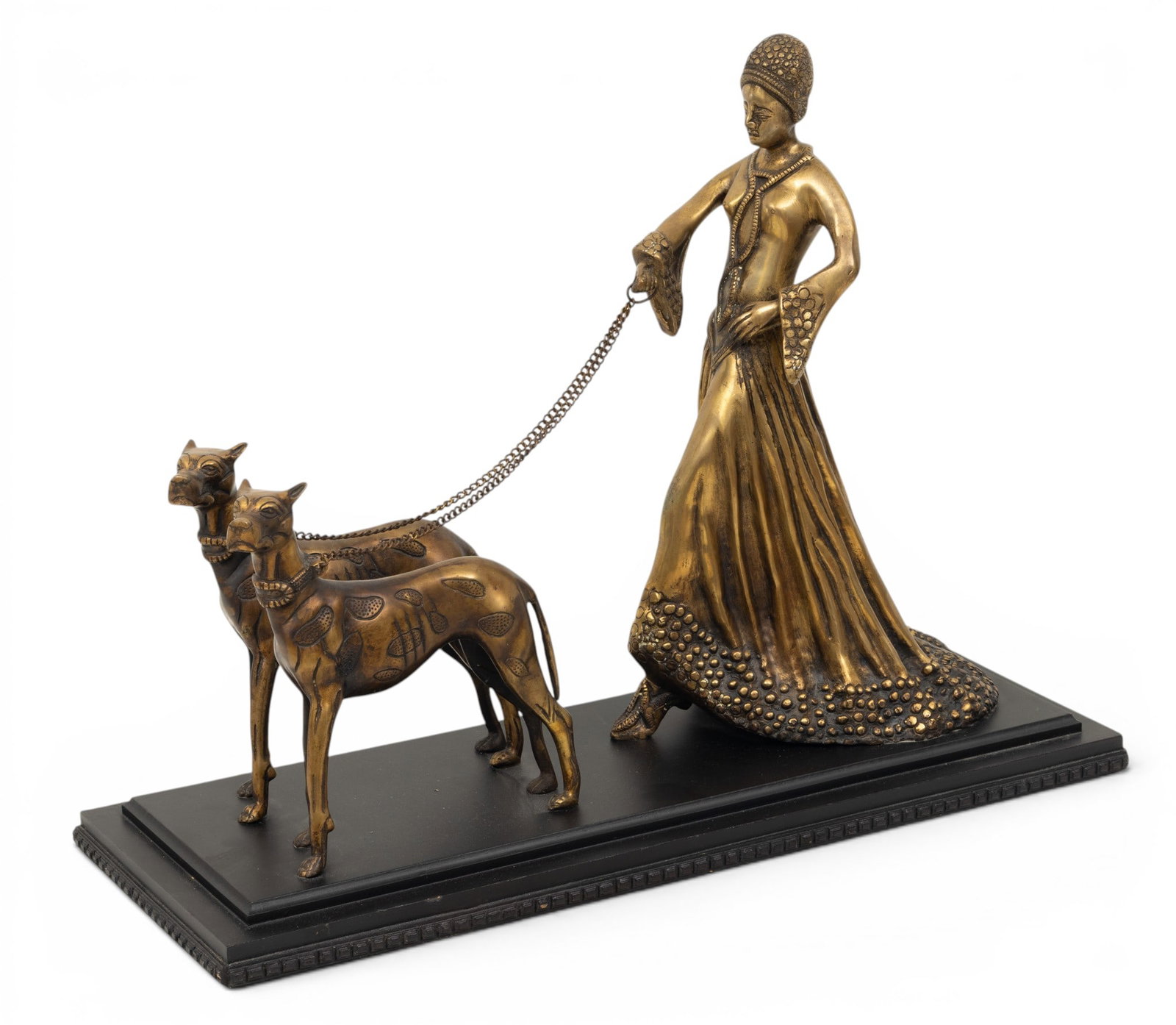 In the Manner of Demetre Chiparus (Romanian, 1886-1947) Bronze Sculpture of an Woman Walking Her: In the Manner of Demetre Chiparus (Romanian, 1886-1947) Bronze Sculpture of an Woman Walking Her Dogs, Ca. Mid 20th C., H 17" W 9" L 24" Unsigned. Bronze sculpture of an elegant woman walking a pair o