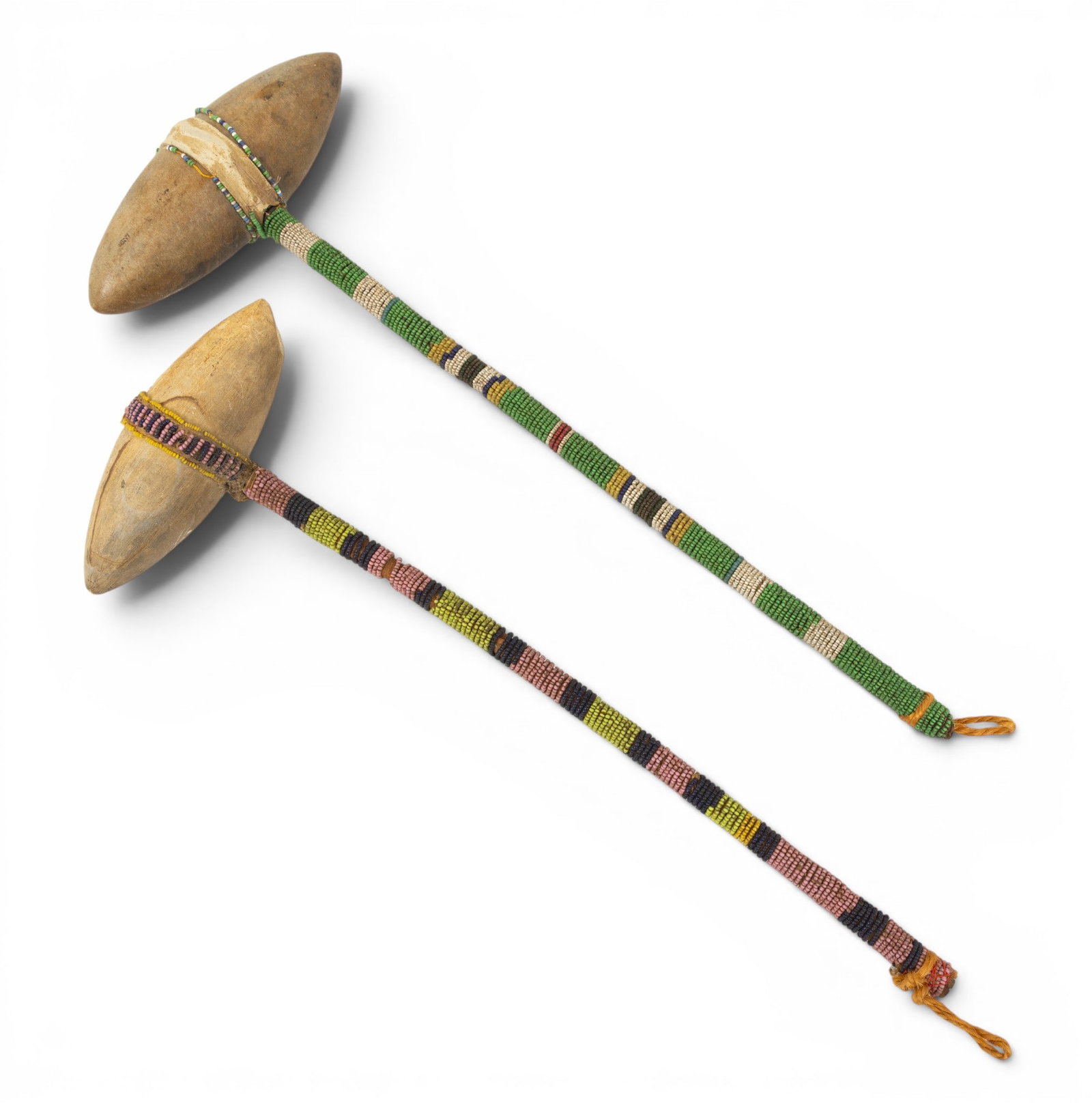 Native American, Plains Region, Stone, Wood and Beadwork Ceremonial War Clubs, Ca. Late 19th C., H: Native American, Plains Region, Stone, Wood and Beadwork Ceremonial War Clubs, Ca. Late 19th C., H 16" W 6" 2 PCS one is H. 16" l. 6", and the other is H.16.5" W. 6.5". Dimensions: H 16" W 6" 2 