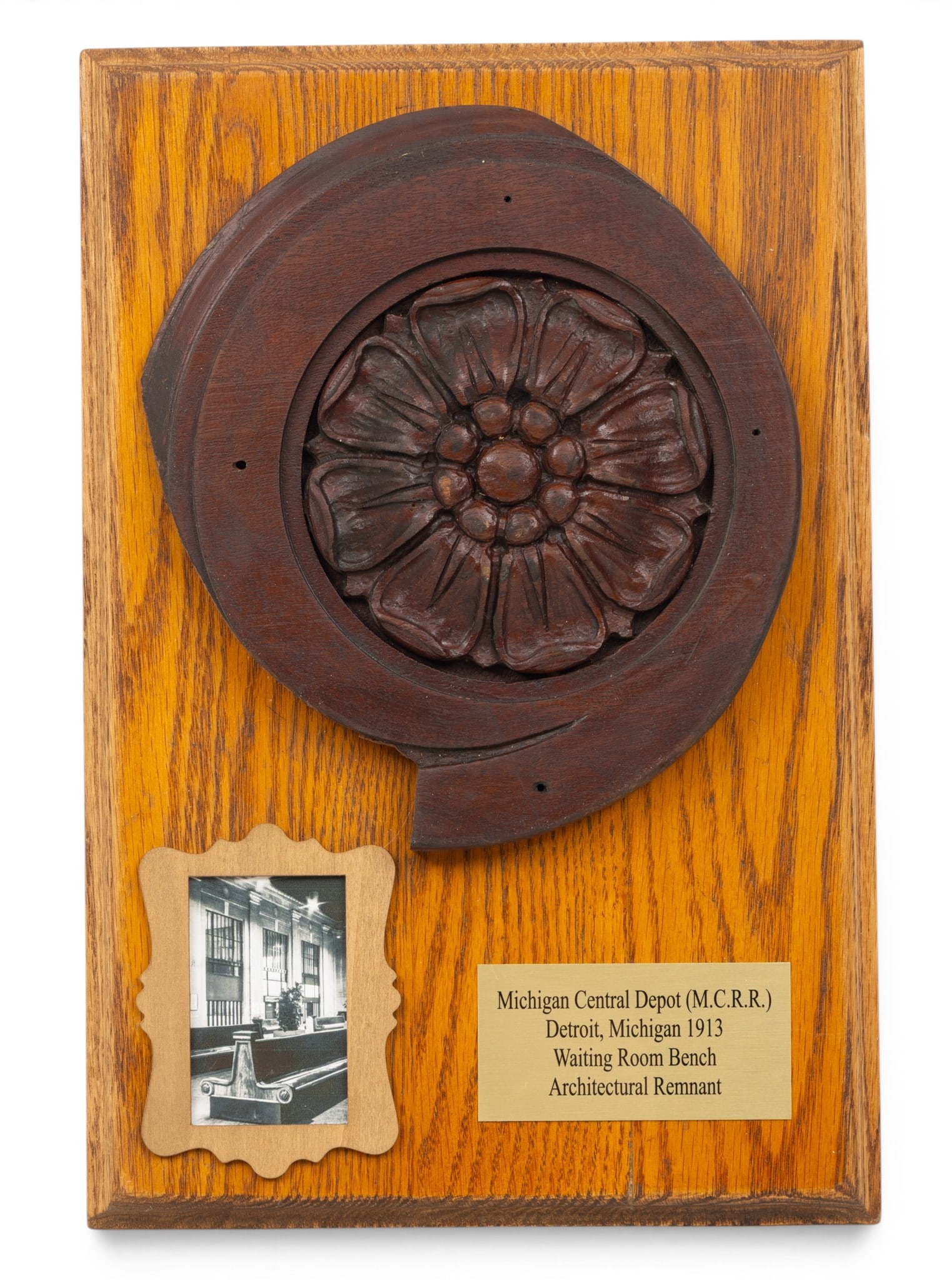 Michigan Central Railroad Depot Carved Wood Ornamental Element, Ca. 1913 Dia. 9": Michigan Central Railroad Depot Carved Wood Ornamental Element, Ca. 1913 Dia. 9" Carved wood rosette Dia. 9" mounted to an oval plaque H 15.25" W 10.25". "For 75 years, the depot shipped De