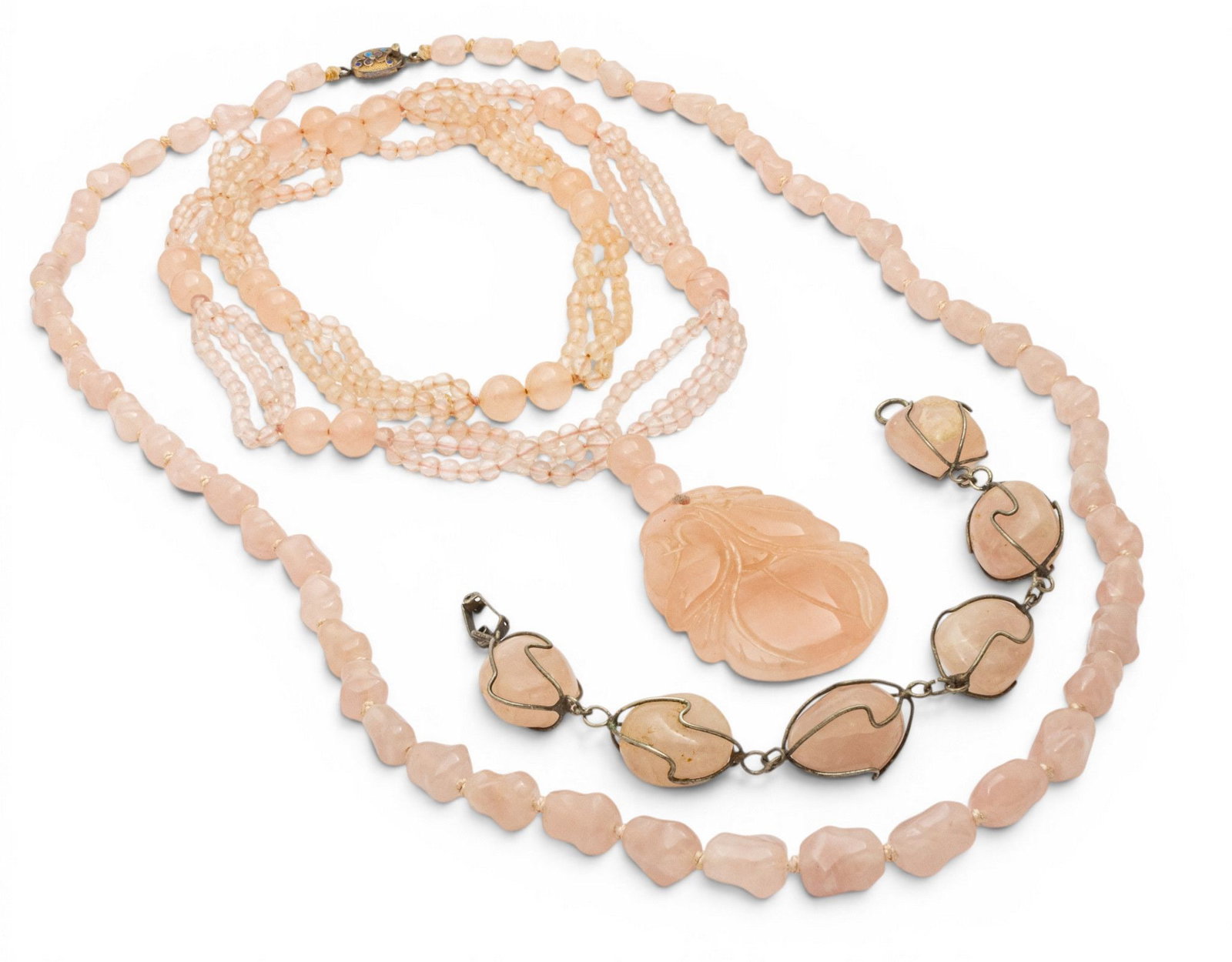 Chinese Carved Pink Quartz Necklaces (2) and Bracelet 1950, L 29" 3 PCS: Chinese Carved Pink Quartz Necklaces (2) and Bracelet 1950, L 29" 3 PCS Double strand 98grams with carved pendant 29" long. Single strand26" carved in graduated sizes, 63 grams. Bracelet 8" havi