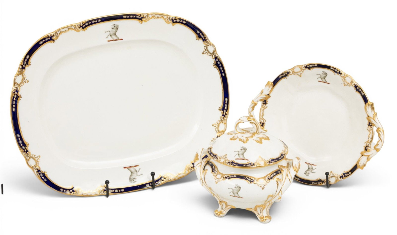 Armorial Porcelain Tureen, Platter and Dish Late 19th C., 3 PCS: Armorial Porcelain Tureen, Platter and Dish Late 19th C., 3 PCS With cobalt blue and gilt decoration. Each piece decorated with rampant rams with their forelegs up. Includes a platter W 15" D 12", tur