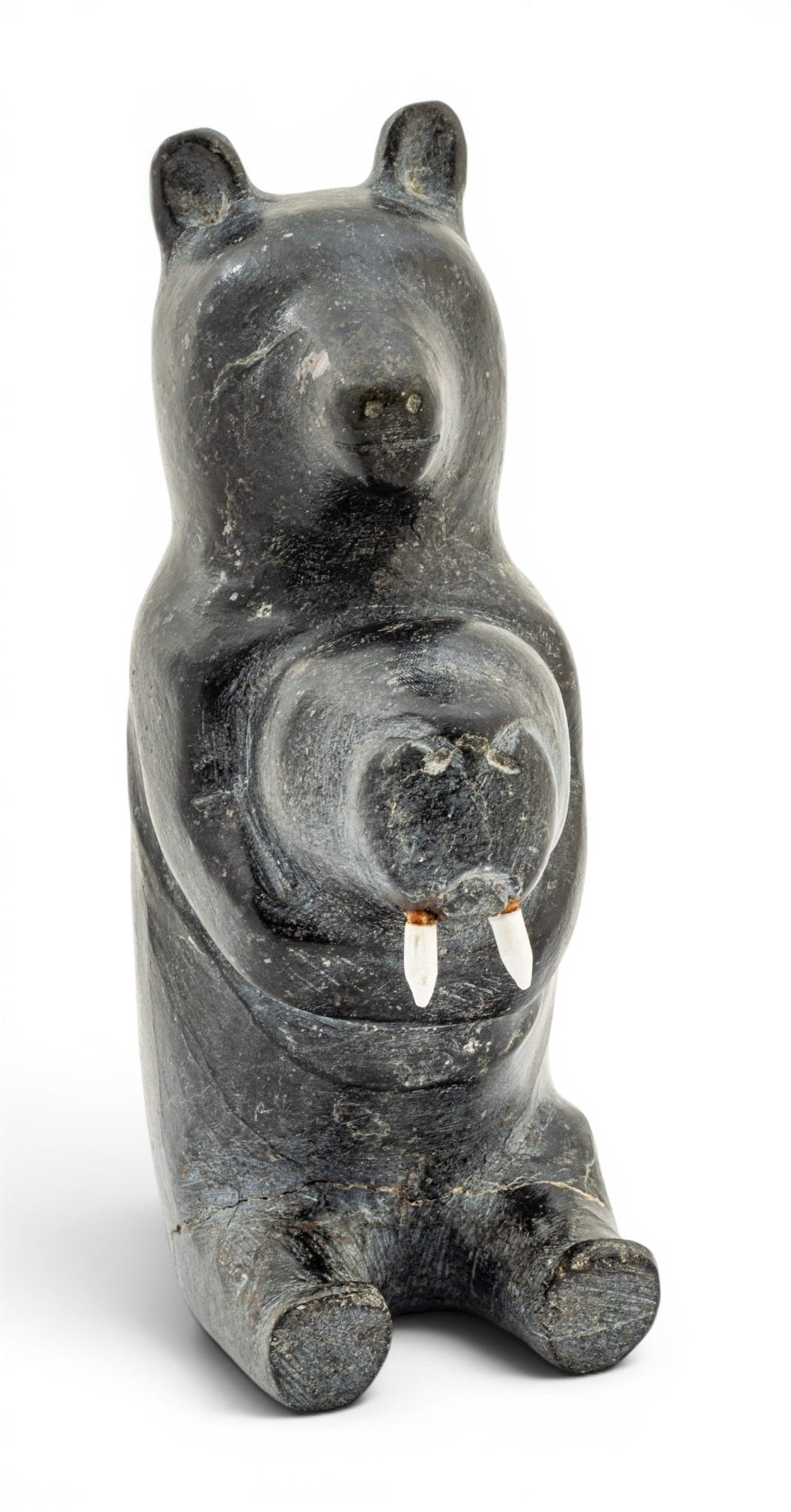 Cape Dorset Inuit Carved Stone Sculpture 1960-1970, 'Bear and Walrus': Cape Dorset Inuit Carved Stone Sculpture 1960-1970, 'Bear and Walrus' Depicting a seated bear holding a walrus with faux ivory tusks. Unsigned. Provenance: Property from the estate collection of