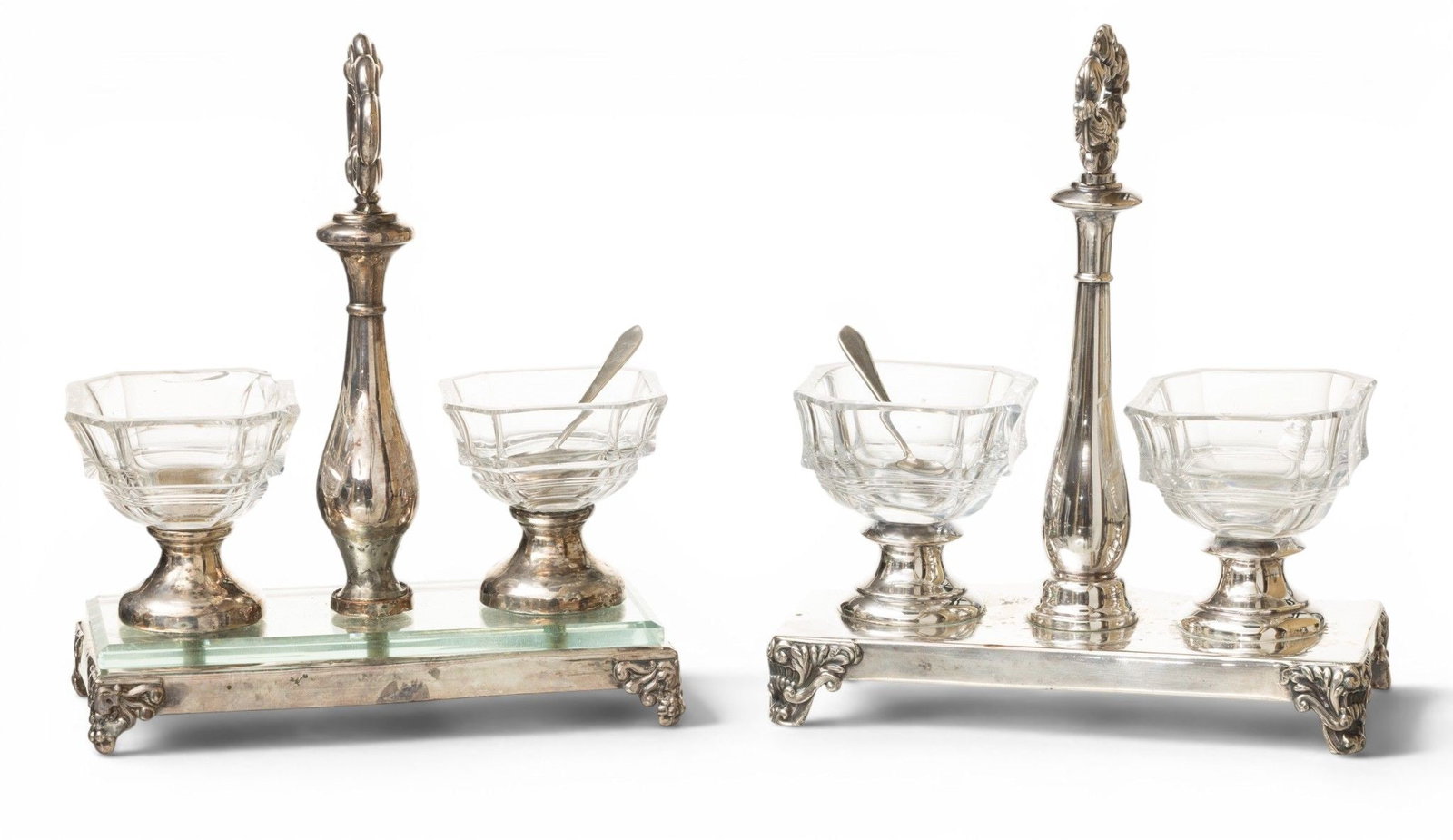 Silverplate Double Salt Stand H 7.5" W 6.5" Depth 3" 1 PAIR: Silverplate Double Salt Stand H 7.5" W 6.5" Depth 3" 1 PAIR Silverplate with cut glass salts. Includes a pair of small Stieff sterling silver spoons. Provenance: From the Estate of Frank Isbey, 