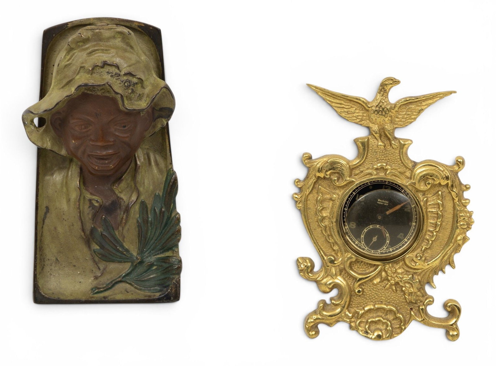 American Brass Watch Holder 5" X 3" and Cast Iron Black Boy Inkwell 1900, H 2" W 3" L 6" 2 PCS: American Brass Watch Holder 5" X 3" and Cast Iron Black Boy Inkwell 1900, H 2" W 3" L 6" 2 PCS American pocket watch table display case with American eagle Circa 1900. Also tabletop cast iron in