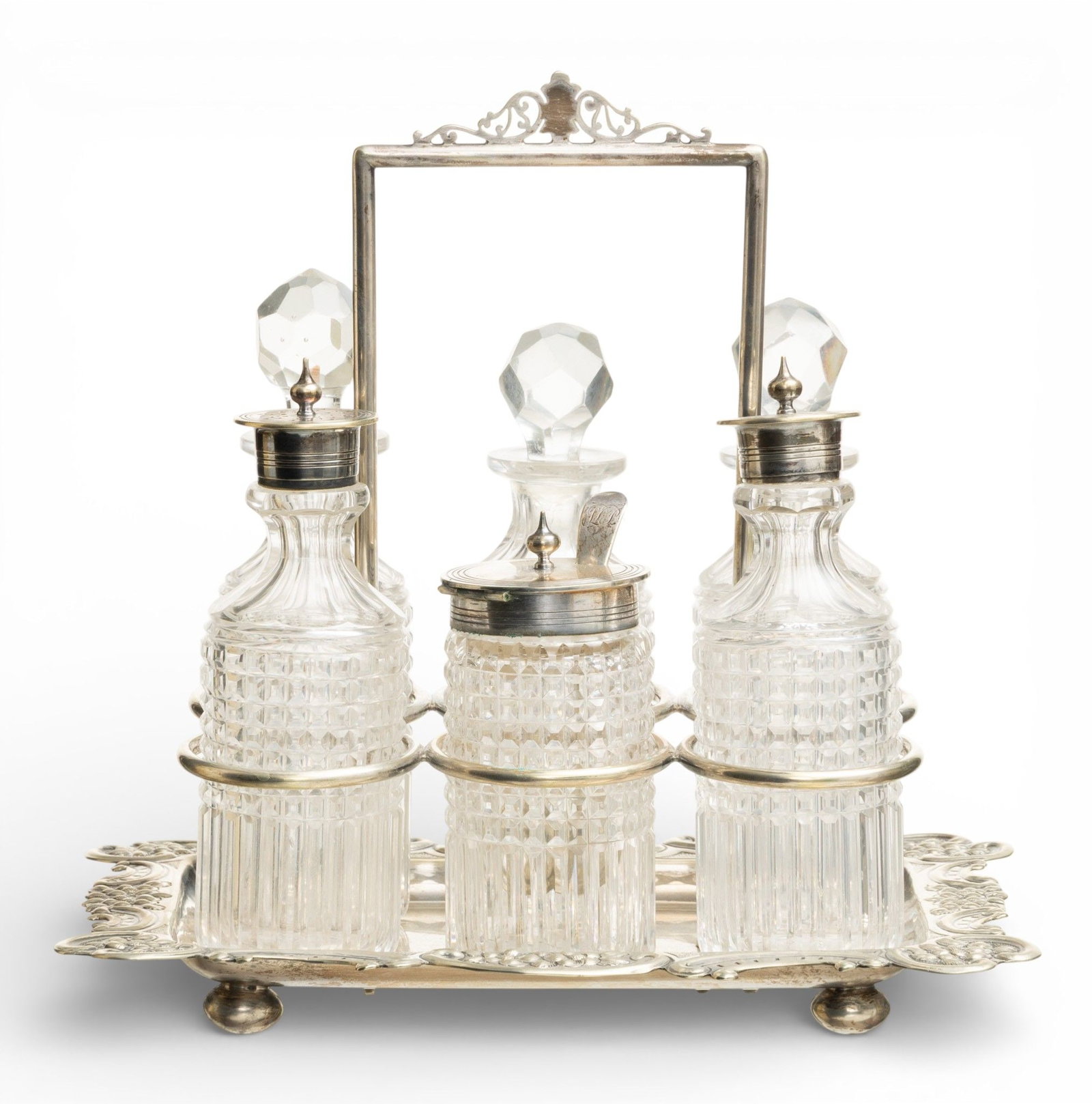 William Hutton & Sons Sheffield Plate Cruet Set, Six Bottles 1900, H 9" W 8.7" Depth 6.5": William Hutton & Sons Sheffield Plate Cruet Set, Six Bottles 1900, H 9" W 8.7" Depth 6.5" #8964. Made in England by WH & S. Six crystal bottles with Sheffield silver plate lids or glass stoppers. 
