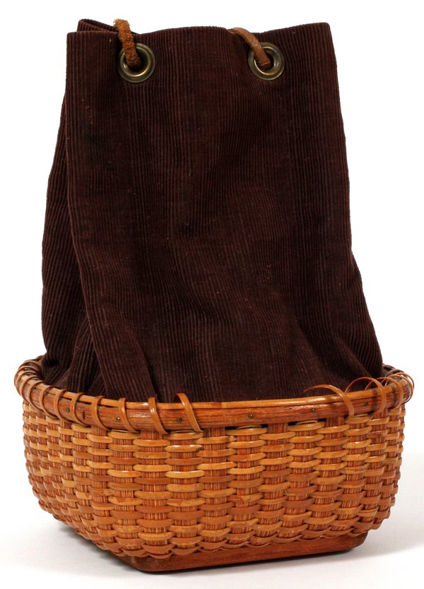 JOSE FORMOSO REYES NAN. FRIENDSHIP BASKET PURSE: JOSE FORMOSO REYES (1902-80) NANTUCKET FRIENDSHIP BASKET PURSE, H 3", W 6 1/2" SQUARE:A woven basket purse with a brown corduroy liner and leather drawstring. Marked on the underside "Made in Nantucke