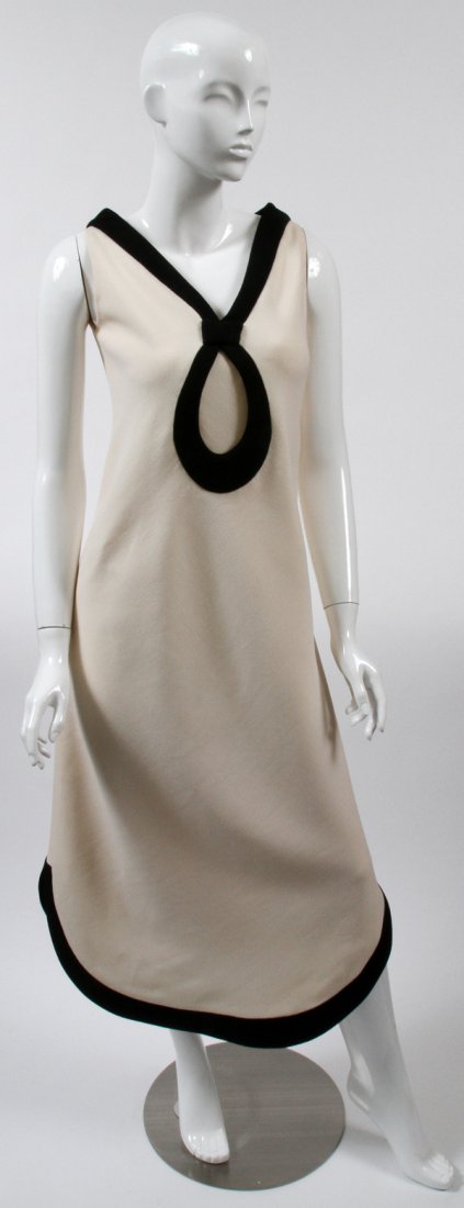 PIERRE CARDIN, CREAM & BLACK EVENING DRESS: PIERRE CARDIN, CREAM & BLACK EVENING DRESS:Size 12. Cream with black trim. Zippered back. Labeled: Pierre Cardin Creation Paris.