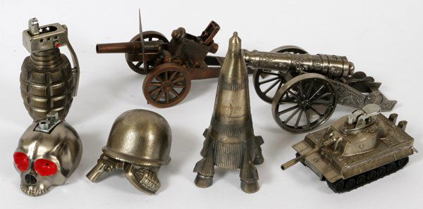 MILITARY THEME METAL CIGARETTE LIGHTERS,, C1950: MILITARY THEME METAL CIGARETTE LIGHTERS,, C1950, 7 PCS., H 2" - 6":plated cast metal lighters depicting a hand grenade, two cannons, one German Tiger tank, one helmet with pistol and hand grenade (all