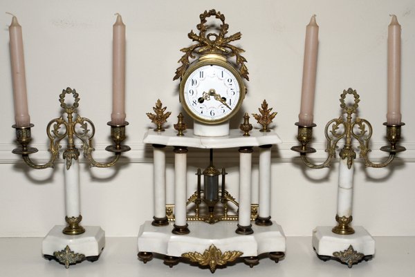FRENCH BRONZE & MARBLE CLOCK GARNITURE, C. 1890: FRENCH BRONZE & MARBLE CLOCK GARNITURE, C. 1890, SET OF THREE PIECES, H 17 1/2" & 12 1/2":Including 1 clock, H.17 1/2" x 10 1/2" x 5", and 2 two-light candelabra, H.12 1/2" x 8 1/2". From the Estate o