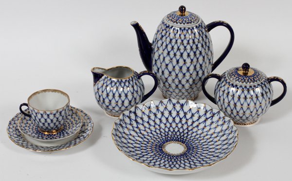 LOMONOSOV PORCELAIN COFFEE SET, SOVIET ERA, 22: LOMONOSOV PORCELAIN COFFEE SET, SOVIET ERA, 22 PIECES:Including 1 coffee pot, 1 creamer, 1 covered sugar bowl, 6 cups and 6 saucers. Fishnet pattern in cobalt blue, stamped in red at the underside for