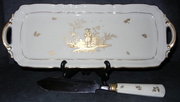 BERNARDAUD & CO. LIMOGES PORCELAIN CHEESE WARE: L. BERNARDAUD & CO., LIMOGES PORCELAIN CHEESE WARE:Cheese plate, knife and tray with oriental scene. Cream with gold trim design. Tray L. 15 1/2"; knife L.11.