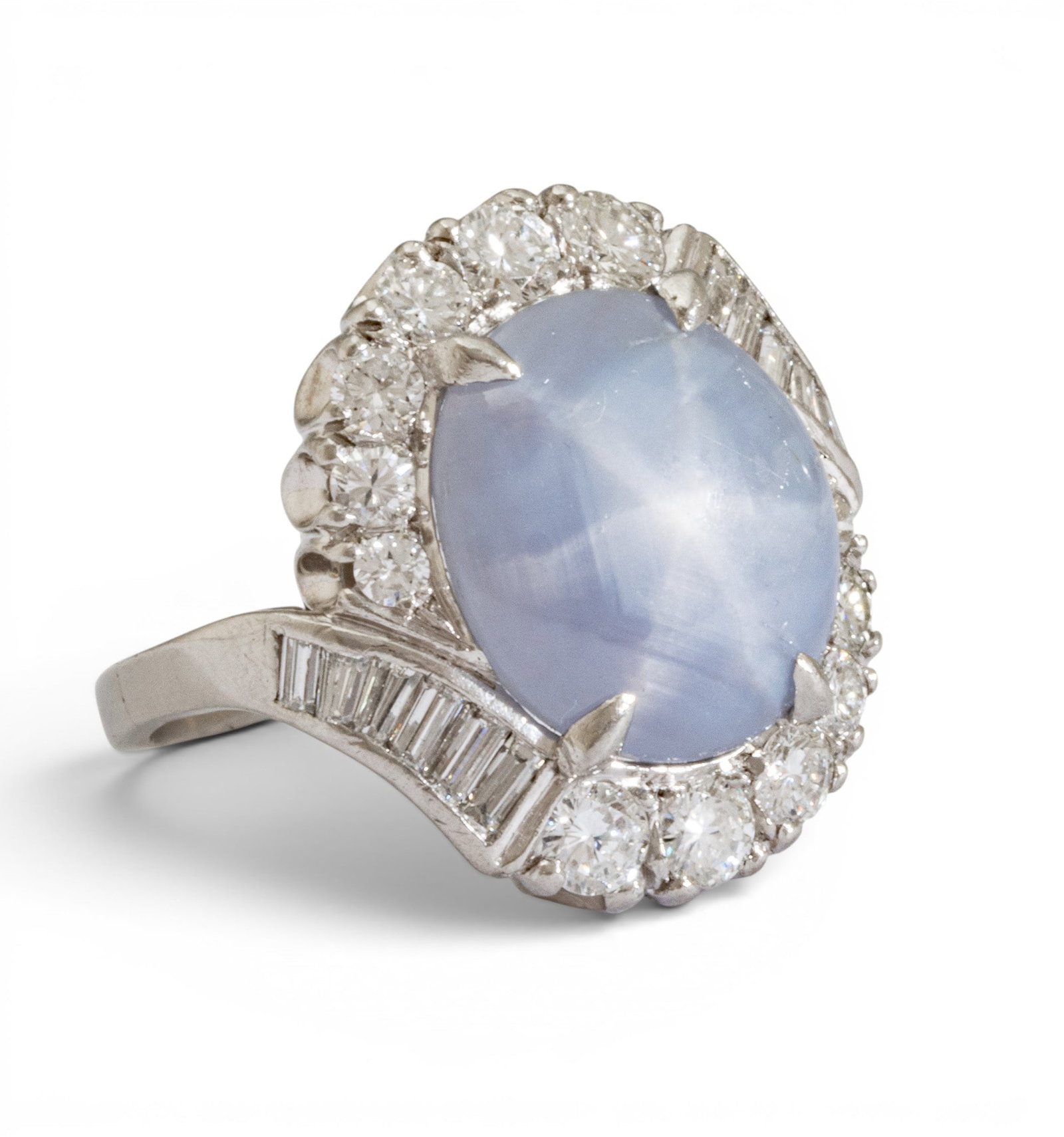 Platinum, Star Sapphire and Diamond Cocktail Ring Size 6 10.1 grams 1 PC: Platinum, Star Sapphire and Diamond Cocktail Ring Size 6 10.1 grams 1 PC A central, cabochon natural blue-gray star sapphire (appx. 13.4 x 12.0 x 5.0 mm) with graduated round, brilliant and baguette d
