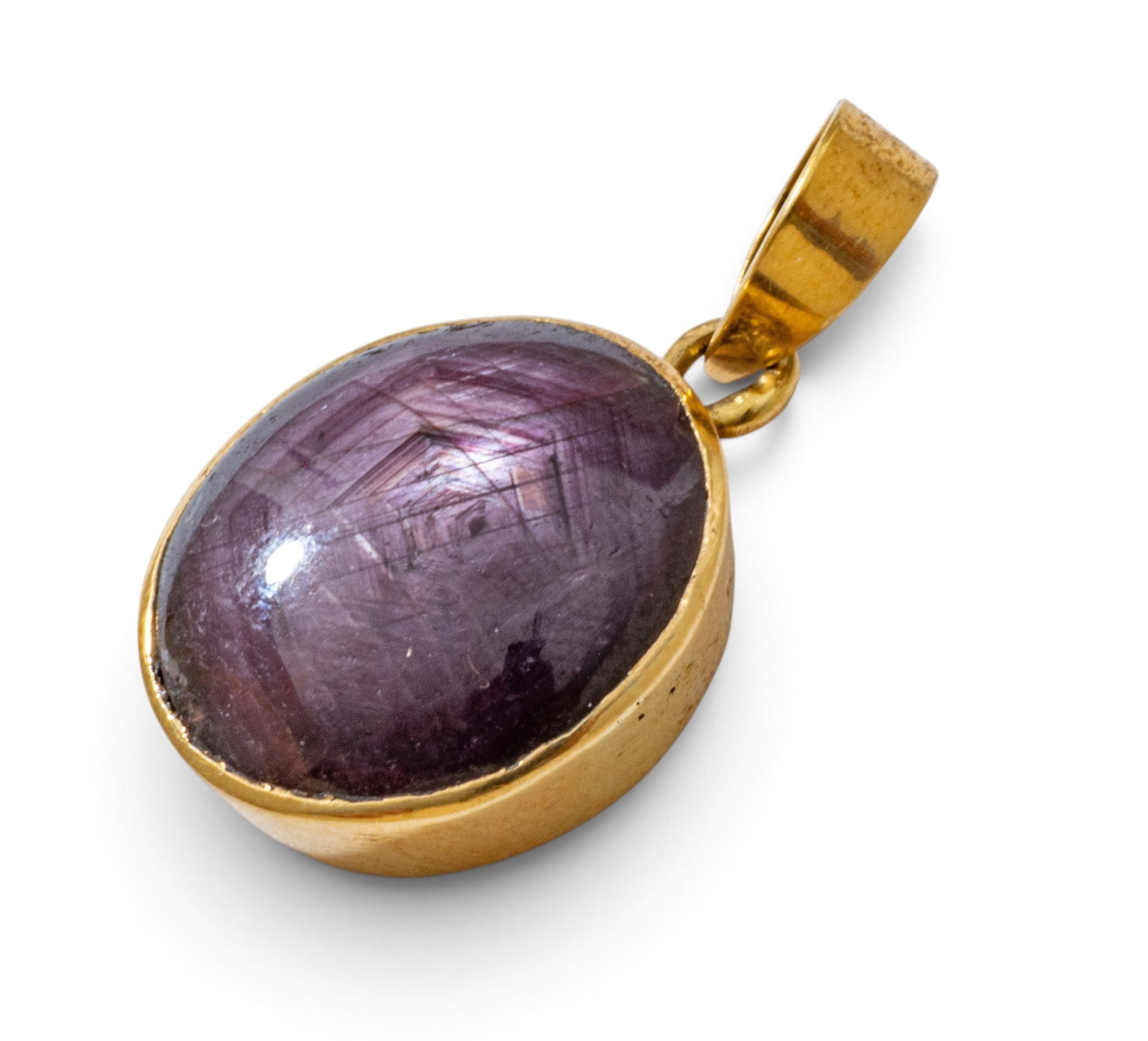 14k Yellow Gold and Star Ruby Pendant H 1" 6.5 grams: 14k Yellow Gold and Star Ruby Pendant H 1" 6.5 grams A cabochon star ruby (appx. 17.3 x 15.7 x 7.4 mm) bezel set in a 14k yellow gold pendant with attached bale. Unmarked. Dimensions: H 1" 6.5 g