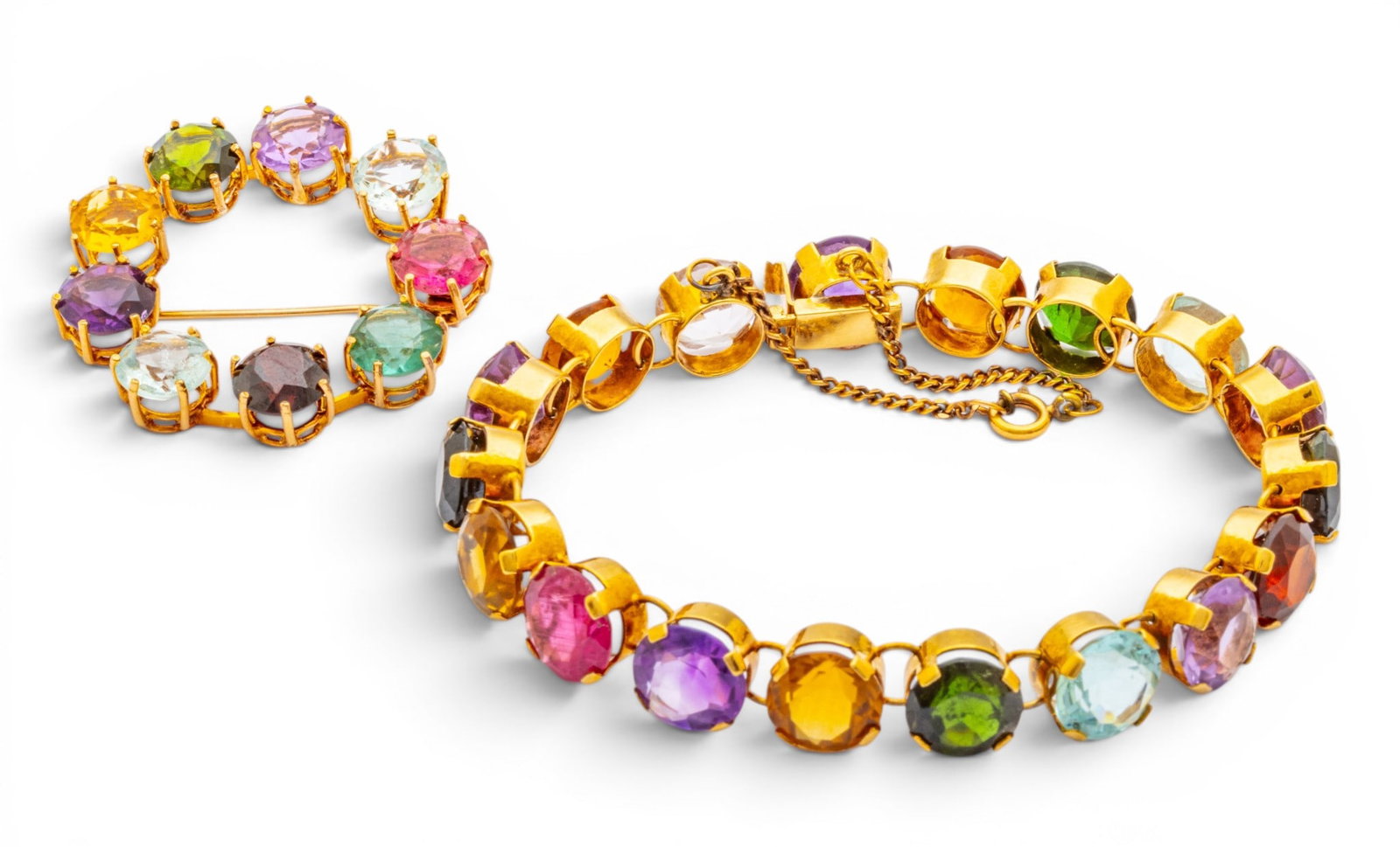 18k Yellow Gold and Gem Set Brooch and Bracelet 31.3 grams 2 PCS: 18k Yellow Gold and Gem Set Brooch and Bracelet 31.3 grams 2 PCS A matching brooch and bracelet set composed of 18k yellow gold and round, brilliant amethyst, citrine, aquamarine, garnet, and tourmali