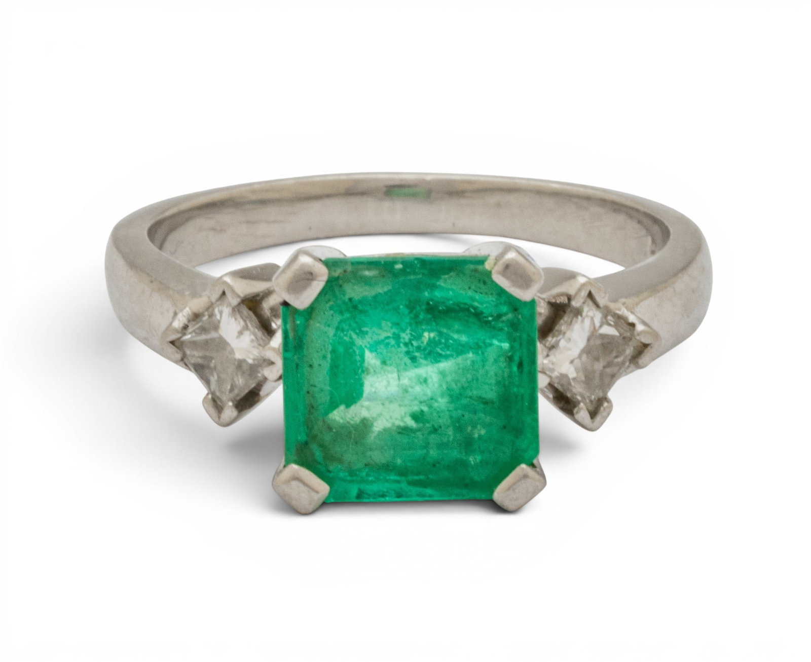 Platinum, Emerald, and Diamond Ring Size 8.5 8 grams: Platinum, Emerald, and Diamond Ring Size 8.5 8 grams A central, square, emerald cut emerald (appx. 8.6 x 8.7 x 4.9mm) having an appx. .12ct princess cut diamond to each shoulder set in a platinum ring